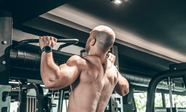A man benefits from a peptide therapy injection during a workout